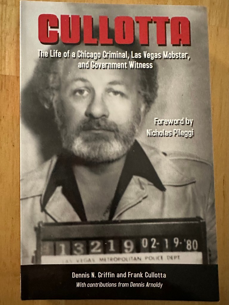 Book Cover of "Cullotta: The Life of a Chicago Criminal, Las Vegas Mobster, and Government Witness," Dennis N. Griffin and Frank Cullotta, Forward by Nicholas Pileggi. The book's cover shows Frank Cullotta's mug shot. He has gray hair and a bread. He looks sad.